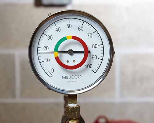 A color coded pressure gauge.