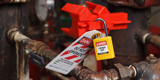 A lockout tagout device applied to a valve.